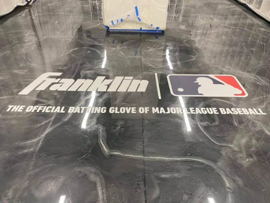 Franklin Sports swirl epoxy flooring with logo in Stoughton, MA.