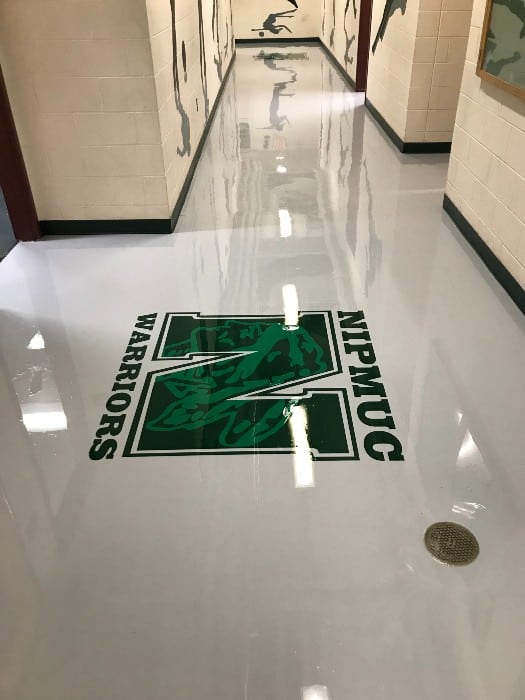 Nipmuc High School hallway with logo in Upton, MA.